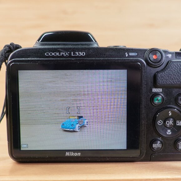 The Nikon Coolpix L330 is a vintage-style 20.2MP digital camera featuring a powe - Picture 5 of 7